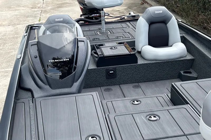 Slide: The Image of 2027 Tracker Savage 215 boat interior with sleek seating and storage compartments. - 14