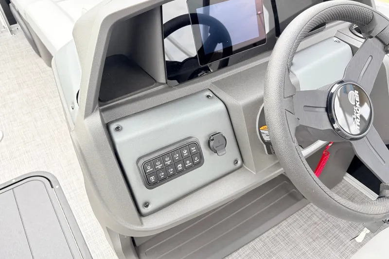 Slide: The Image of 2027 Sun Tracker Party Barge 22 RF XP3 dashboard with steering wheel and control panel. - 30