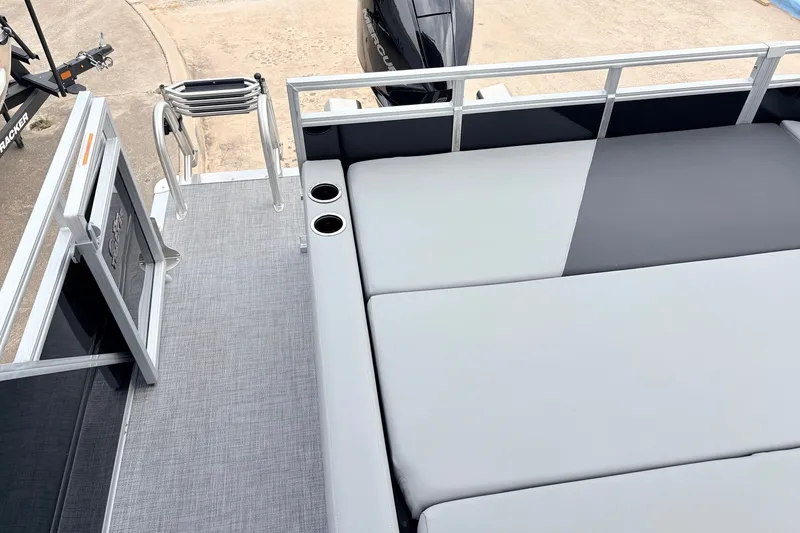 Slide: The Image of 2027 Sun Tracker Party Barge 22 RF XP3 with seating and cup holders on deck. - 49