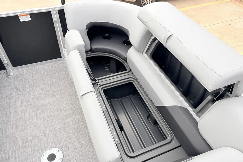 Slide: The Image of 2027 Sun Tracker Party Barge 22 RF XP3 interior with open storage compartments. - 22