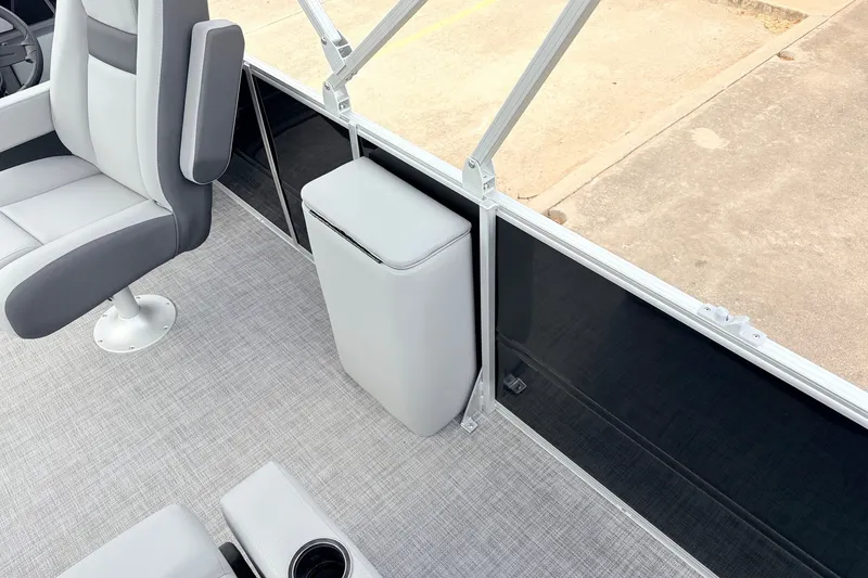 Slide: The Image of 2027 Sun Tracker Party Barge 22 RF XP3 interior with gray seating and flooring. - 34