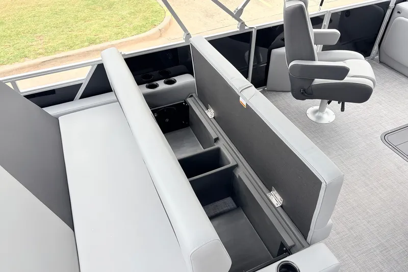 Slide: The Image of 2027 Sun Tracker Party Barge 22 RF XP3 interior with open storage compartments and seating. - 45