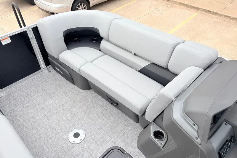 Slide: The Image of 2027 Sun Tracker Party Barge 22 RF XP3 interior with gray seating and cup holders. - 18