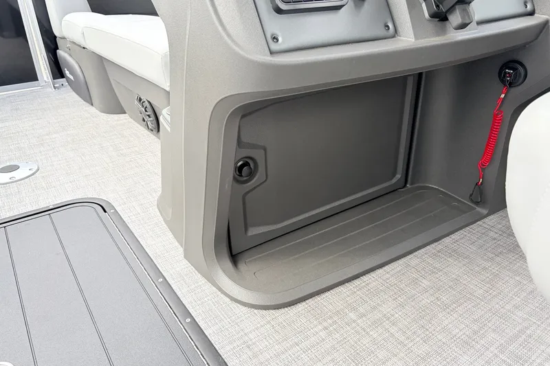 Slide: The Image of Interior of 2027 Sun Tracker Party Barge 22 RF XP3, featuring storage compartment and seating. - 32