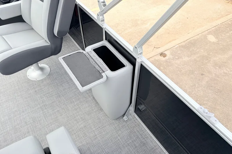 Slide: The Image of 2027 Sun Tracker Party Barge 22 RF XP3 interior with seating and storage compartment. - 35