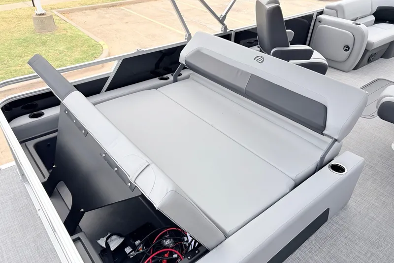 Slide: The Image of 2027 Sun Tracker Party Barge 22 RF XP3 interior with gray seating and cup holders. - 44