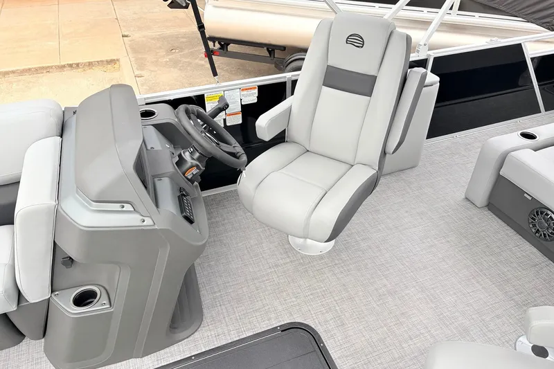 Slide: The Image of 2027 Sun Tracker Party Barge 22 RF XP3 interior with helm and seating area. - 27