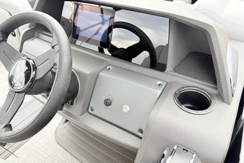 Slide: The Image of Steering console of 2027 Sun Tracker Party Barge 22 RF XP3 with touchscreen display. - 31