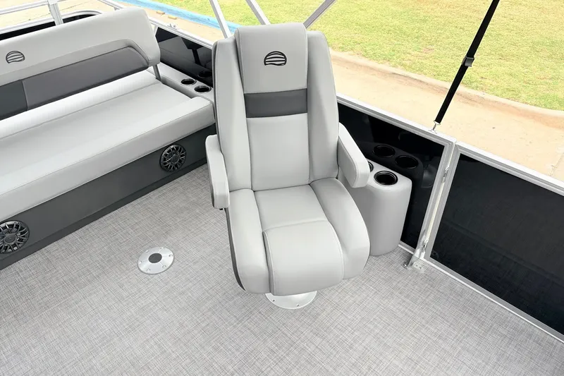 Slide: The Image of 2027 Sun Tracker Party Barge 22 RF XP3 interior with gray seating and cup holders. - 26