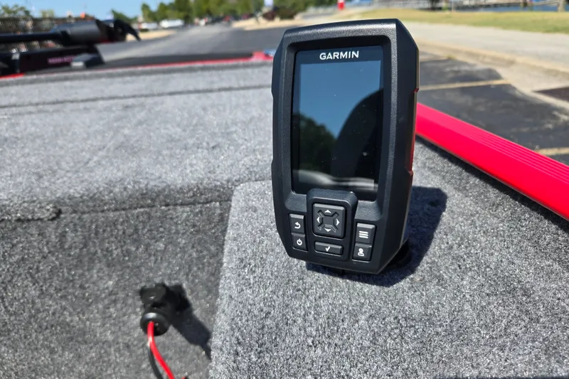 Slide: The Image of Garmin device on 2027 Tracker Panfish 17 boat, gray carpeted surface, sunny day. - 14