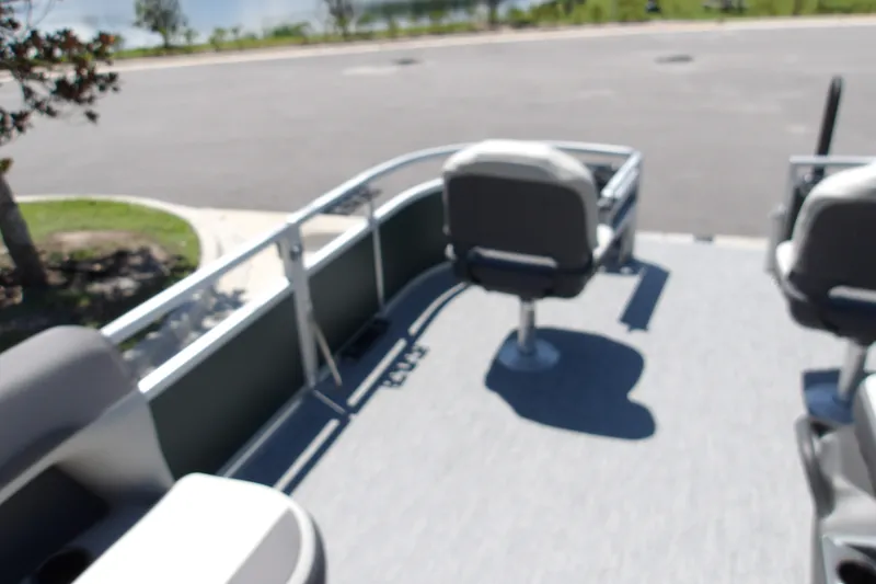 Slide: The Image of 2027 Sun Tracker Bass Buggy 16 XL Select pontoon boat interior with seating. - 19