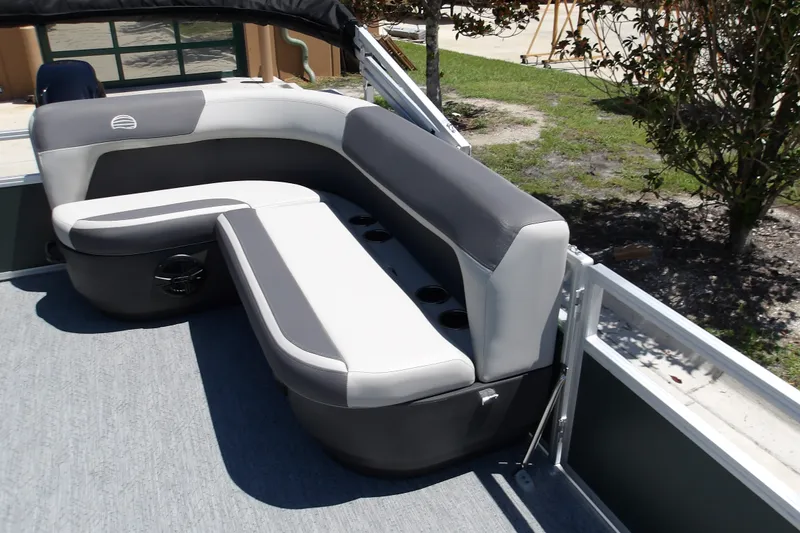 Slide: The Image of 2027 Sun Tracker Bass Buggy 16 XL Select pontoon boat seating area with cup holders. - 15