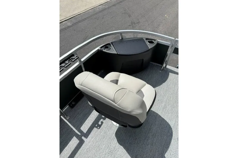 Slide: The Image of 2027 Sun Tracker Bass Buggy 18 DLX boat interior with seating and console. - 15
