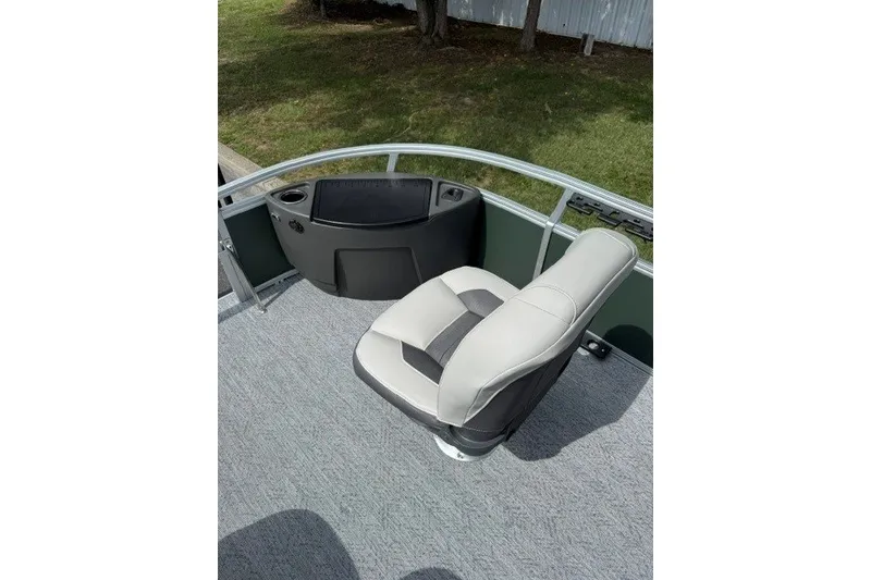 Slide: The Image of 2027 Sun Tracker Bass Buggy 18 DLX boat seat with console, outdoor setting. - 14