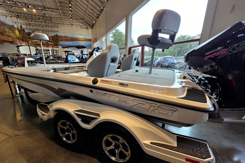 Slide: The Image of 2027 Nitro Z18 XL Pro boat displayed indoors with Mercury Pro XS engine. - 1