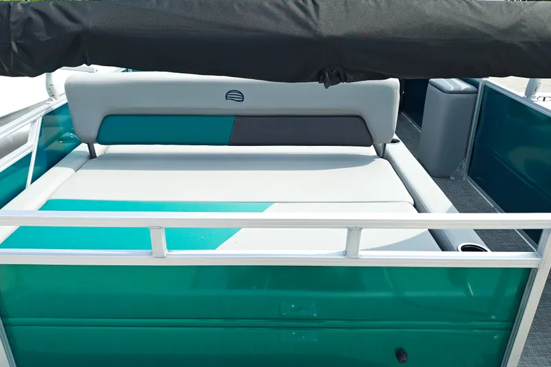 Slide: The Image of 2027 Sun Tracker Party Barge 22 RF XP3 pontoon boat interior with teal and gray seating. - 30