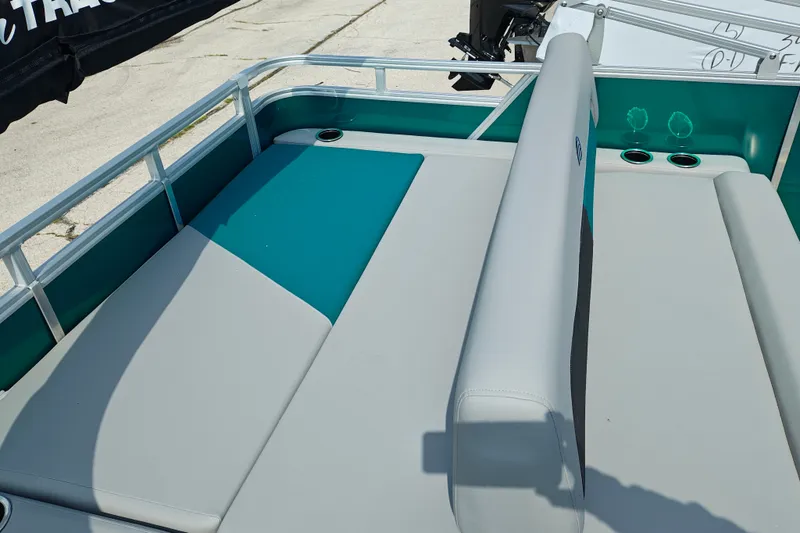 Slide: The Image of 2027 Sun Tracker Party Barge 22 RF XP3 interior with teal and gray seating. - 25
