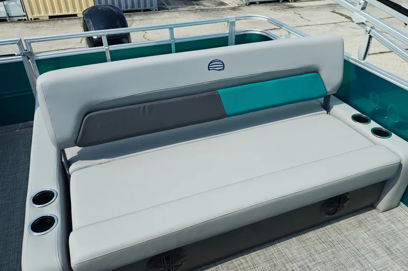 Slide: The Image of 2027 Sun Tracker Party Barge 22 RF XP3 seating area with cup holders and stylish upholstery. - 23