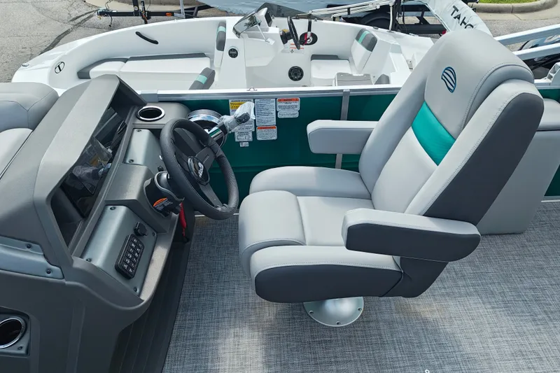 Slide: The Image of 2027 Sun Tracker Party Barge 22 RF XP3 interior with steering wheel and captain's chair. - 19