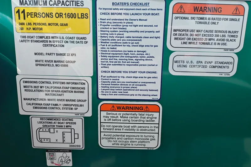 Slide: The Image of Sun Tracker Party Barge 22 RF XP3 safety and capacity labels, 2027 model, compliance details. - 22
