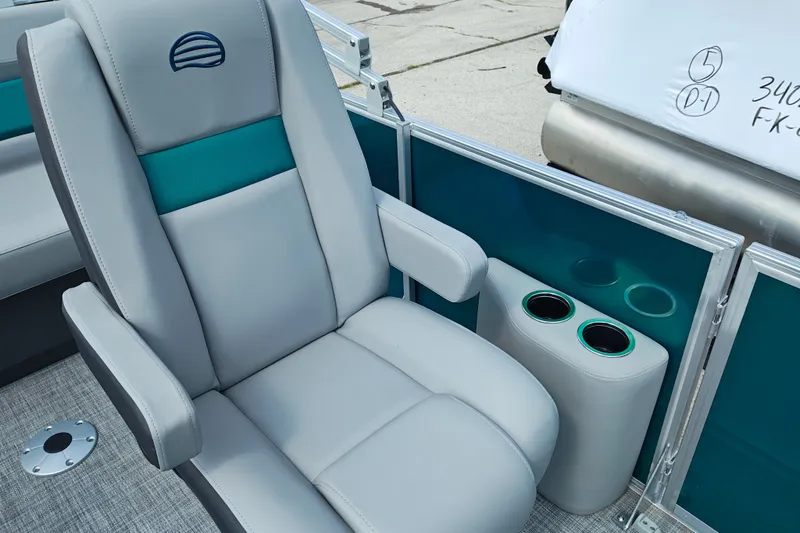 Slide: The Image of 2027 Sun Tracker Party Barge 22 RF XP3 boat seat with cup holders and sleek design. - 18