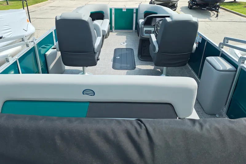 Slide: The Image of 2027 Sun Tracker Party Barge 22 RF XP3 interior with seating and steering console. - 31