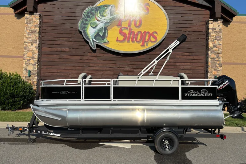 The Image of 2027 Sun Tracker Bass Buggy 18 DLX pontoon boat displayed at Bass Pro Shops. - 0