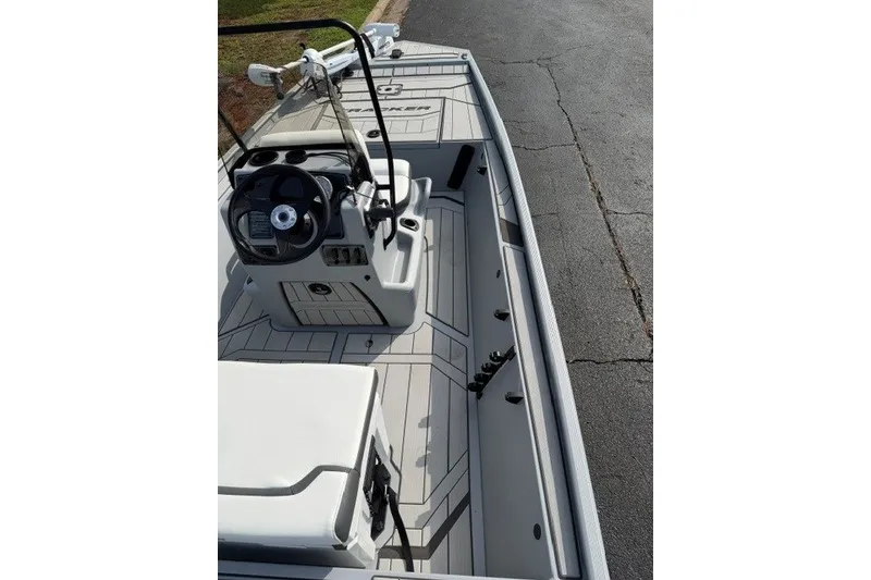 Slide: The Image of 2027 Tracker Bass Tracker Classic CC boat interior with steering console and seating. - 16