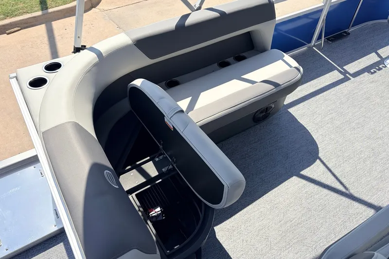 Slide: The Image of 2027 Sun Tracker Bass Buggy 16 XL Select pontoon boat interior with seating and cup holders. - 22