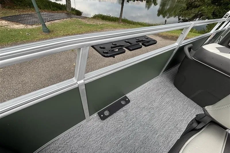 Slide: The Image of 2027 Sun Tracker Bass Buggy 18 DLX pontoon boat interior with seating and railing details. - 17