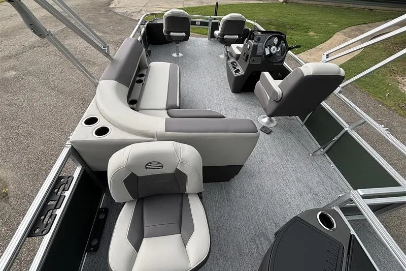 Slide: The Image of 2027 Sun Tracker Bass Buggy 18 DLX pontoon boat interior with seating and steering console. - 30