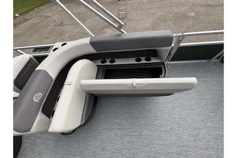 Slide: The Image of 2027 Sun Tracker Bass Buggy 18 DLX pontoon boat with open storage compartment and seating. - 20