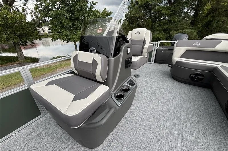 Slide: The Image of 2027 Sun Tracker Bass Buggy 18 DLX pontoon boat interior with seating and console. - 15