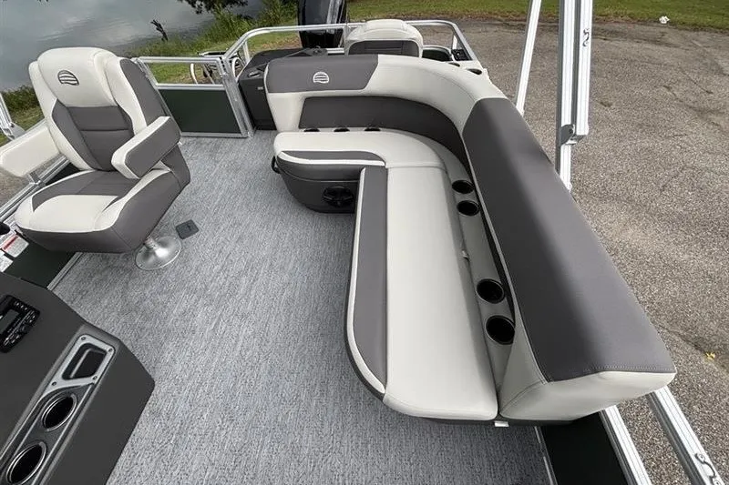 Slide: The Image of 2027 Sun Tracker Bass Buggy 18 DLX interior with gray and white seating. - 19