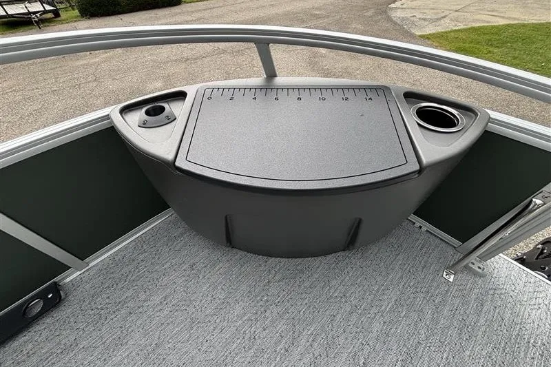Slide: The Image of 2027 Sun Tracker Bass Buggy 18 DLX boat deck with measuring board and cup holders. - 13