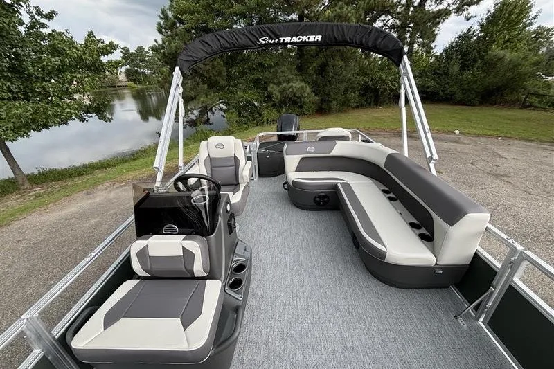 Slide: The Image of 2027 Sun Tracker Bass Buggy 18 DLX pontoon boat with spacious seating and canopy. - 14