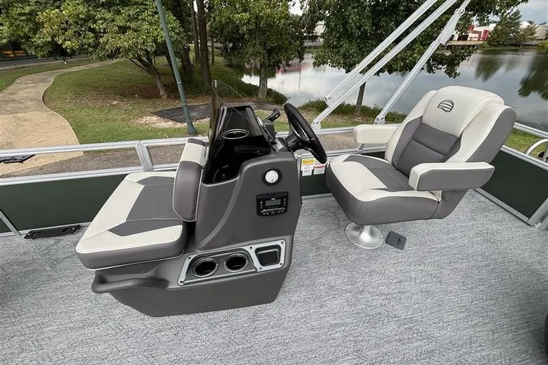 Slide: The Image of 2027 Sun Tracker Bass Buggy 18 DLX interior with comfortable seating and steering console. - 16