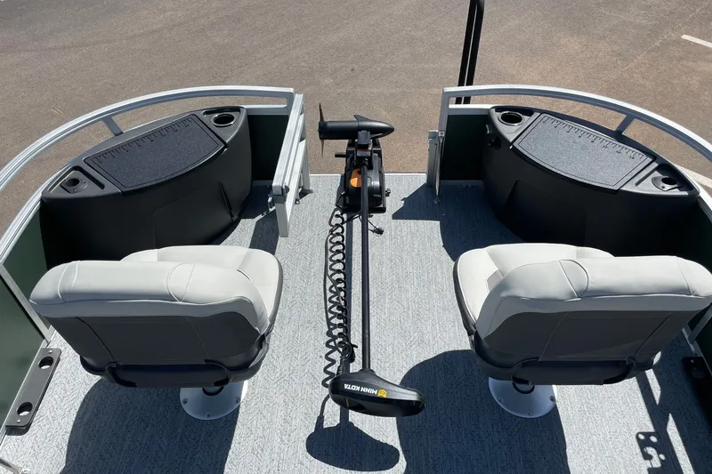 Slide: The Image of 2027 Sun Tracker Fishin' Barge 22 XP3 interior with seating and fishing setup. - 13