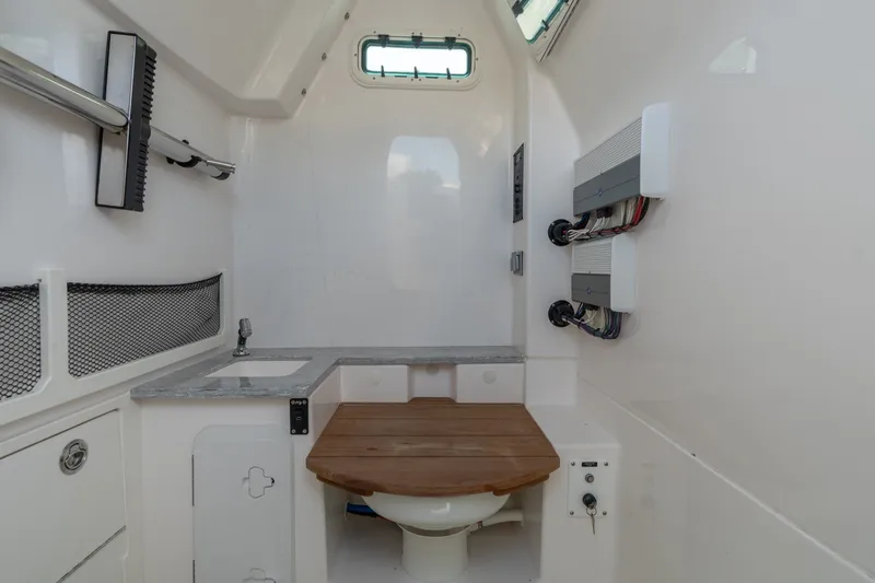 Slide: The Image of Interior of 2020 Everglades 355 Center Console boat with sink and storage. - 27