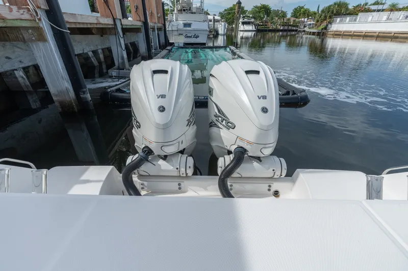 Slide: The Image of Twin Yamaha V8 outboard engines on a 2020 Everglades 355 Center Console boat. - 12