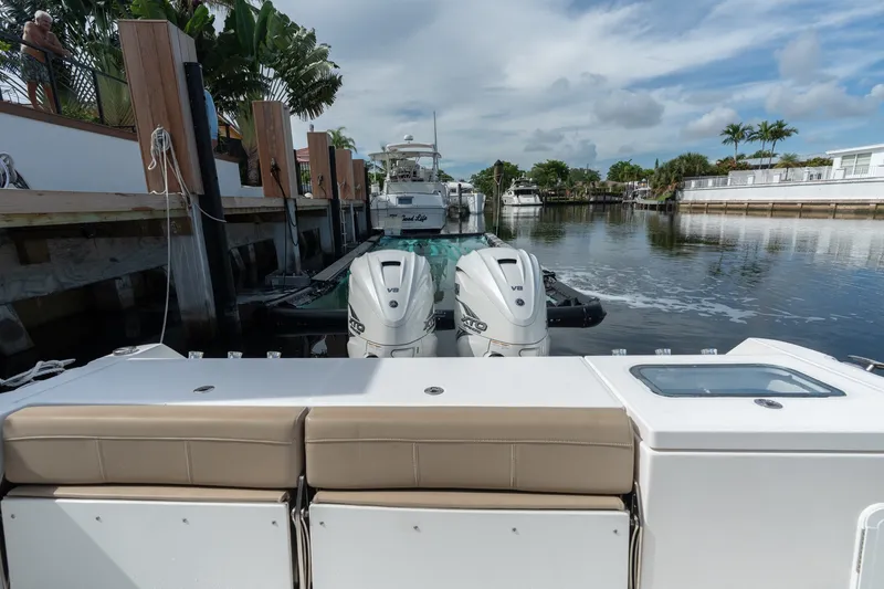 Slide: The Image of 2020 Everglades 355 Center Console boat docked with twin V8 engines. - 26