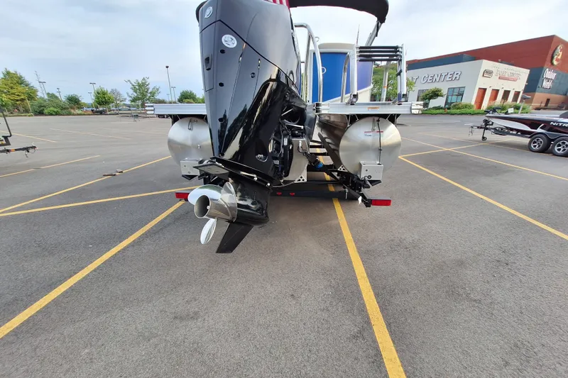 Slide: The Image of 2023 Barletta Cabrio 22QC pontoon boat with powerful outboard motor in parking lot. - 9