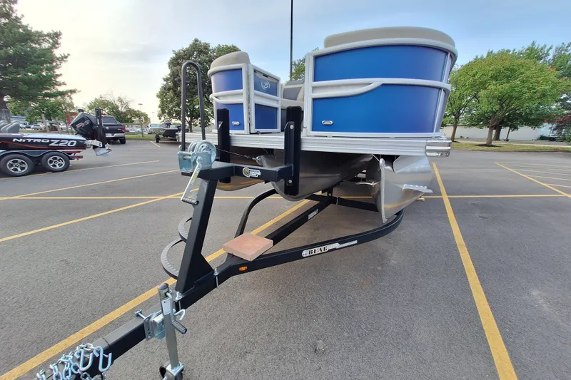 Slide: The Image of 2023 Barletta Cabrio 22QC pontoon boat on trailer in parking lot. - 6