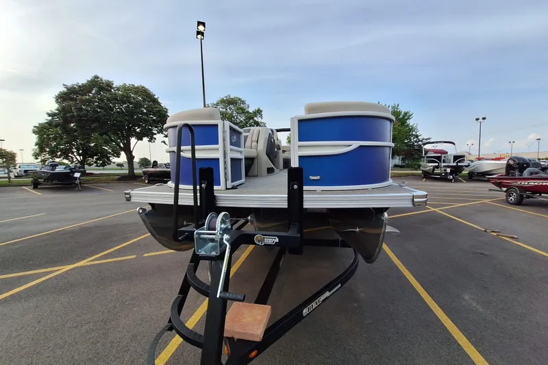 Slide: The Image of 2023 Barletta Cabrio 22QC pontoon boat on trailer in parking lot. - 3