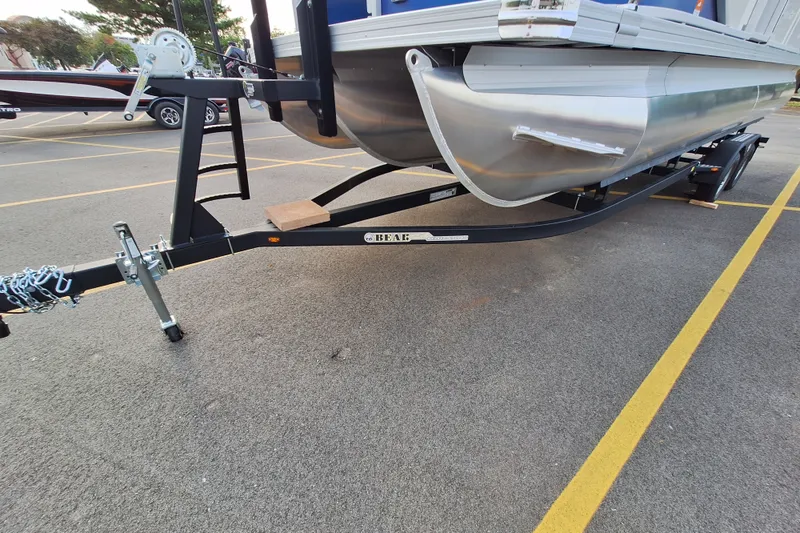 Slide: The Image of 2023 Barletta Cabrio 22QC pontoon boat on trailer in parking lot. - 4