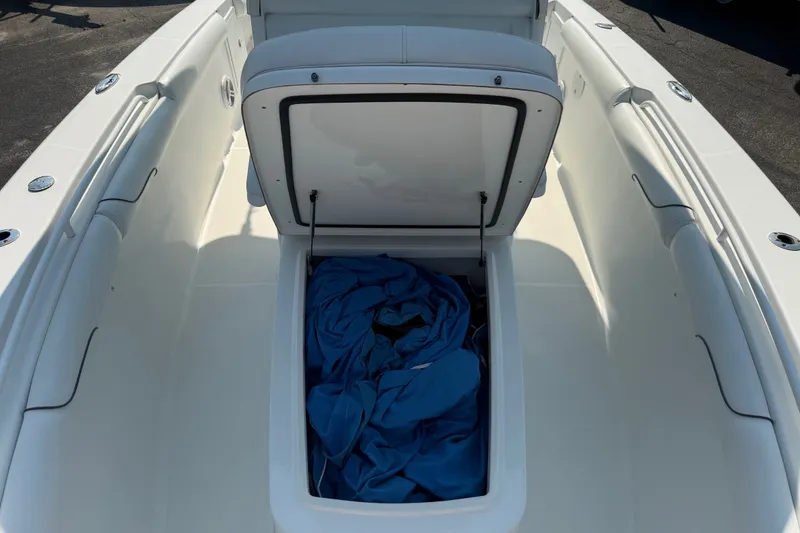 Slide: The Image of 2015 Sea Hunt Gamefish 30CB boat storage compartment with blue fabric inside. - 7