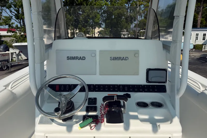 Slide: The Image of 2015 Sea Hunt Gamefish 30CB helm with Simrad electronics and steering wheel. - 8
