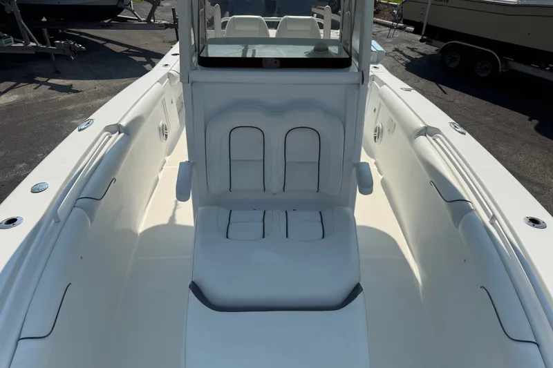 Slide: The Image of 2015 Sea Hunt Gamefish 30CB boat interior with seating and console. - 6