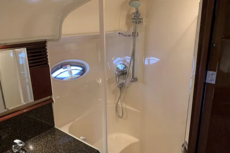 Slide: The Image of Luxurious bathroom in 2007 Sea Ray 52 Sundancer yacht with modern shower fixtures. - 13
