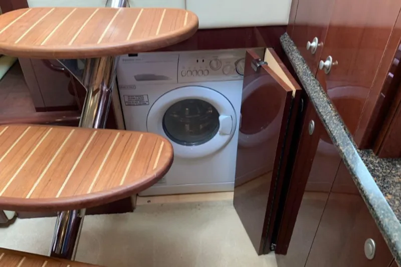 Slide: The Image of Interior of 2007 Sea Ray 52 Sundancer with built-in washer under wooden stairs. - 7